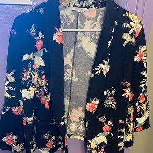 Maurice’s black blazer with flowers.